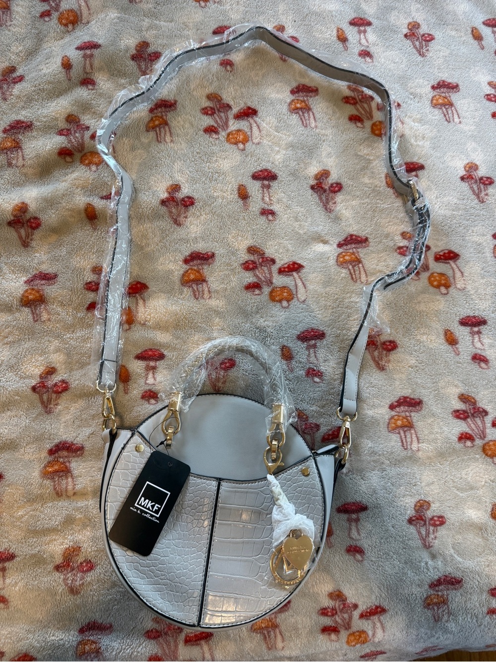 MKF Round Croc-Embossed Crossbody in Light Gray with Gold Hardware